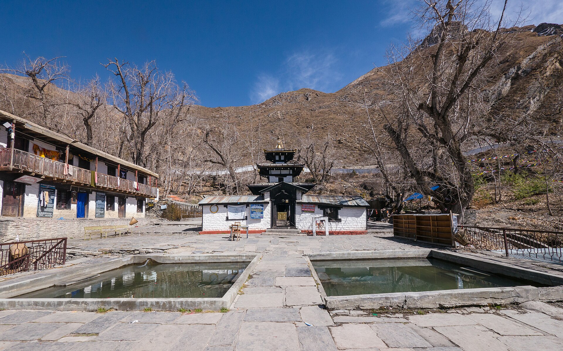 Muktinath temple with its ritual water pools in a stone courtyard